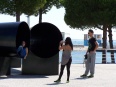 Tourists taking pictures at the Horas de chumbo, Nations' Park waterfall, Lisbon